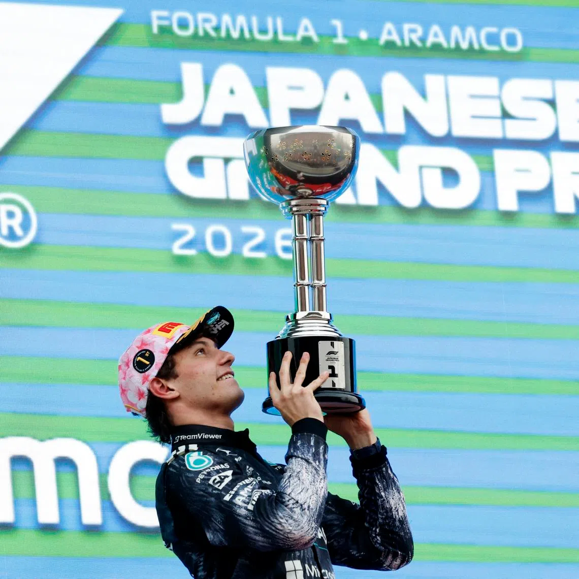 Formula One F1 - Japanese Grand Prix - Suzuka Circuit, Suzuka, Japan - March 29, 2026 Mercedes' Andrea Kimi Antonelli celebrates on the podium with the trophy after winning the Japanese Grand Prix REUTERS/Kim Kyung-Hoon