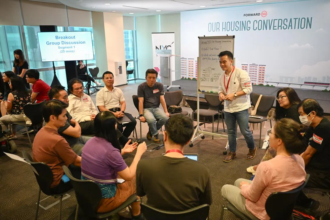 National Development Minister Desmond Lee (seated, facing camera, second from right) with participants in the ongoing exercise to engage Singaporeans on their housing needs and aspirations.
