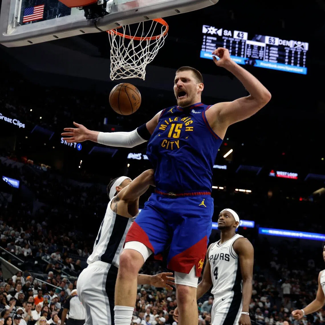Nikola Jokic of the Denver Nuggets reacting after a dunk during the 128-118 NBA win over the San Antonio Spurs in the first half at Frost Bank Center on April 12, 2026 in San Antonio, Texas.