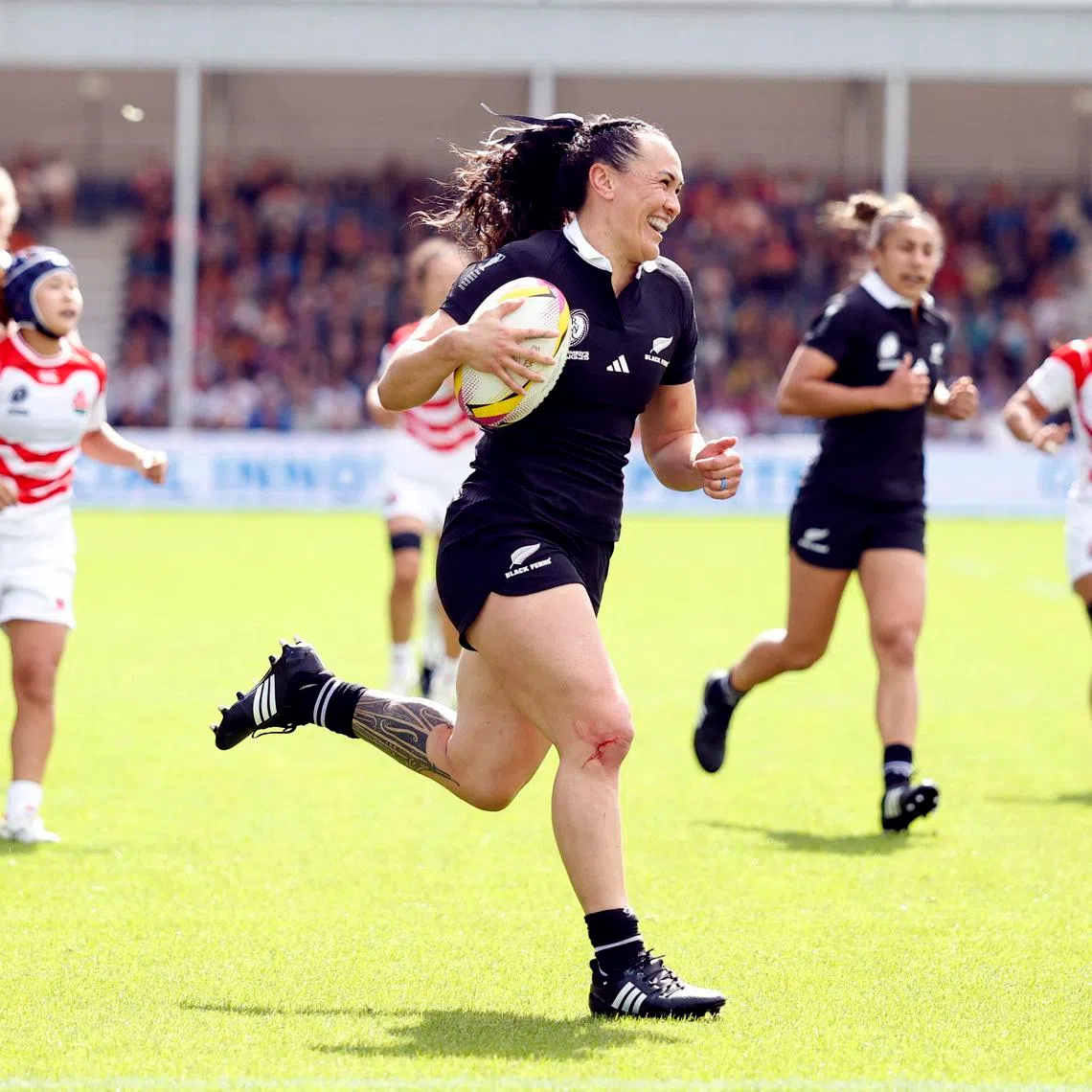 Rugby Union - Women's World Cup 2025 - Pool C - New Zealand v Japan - Sandy Park, Exeter, Britain - August 31, 2025 New Zealand's Portia Woodman-Wickliffe scores their first try Action Images via Reuters/Peter Cziborra