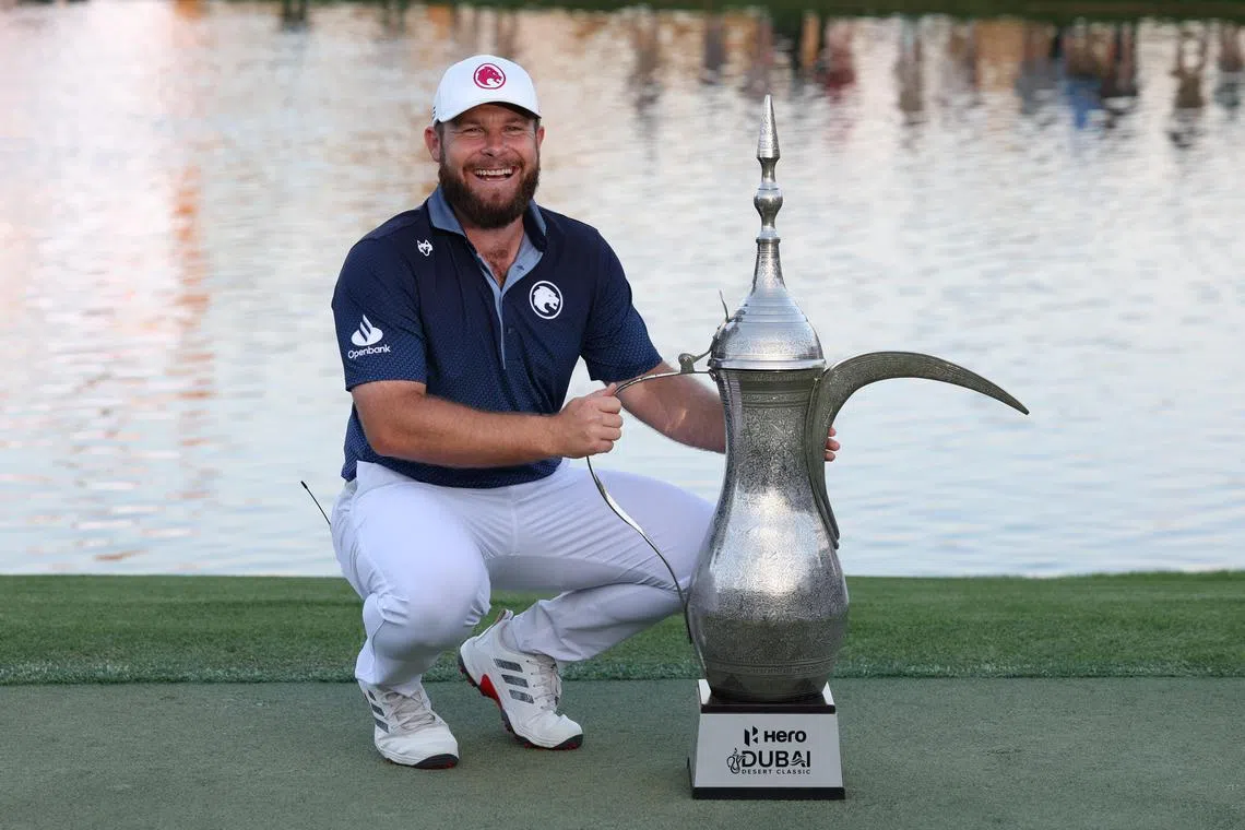 Tyrrell Hatton of England posing with the trophy after winning the final round of the Dubai Desert Classic 2025 Golf tournament in Dubai, United Arab Emirates, on Jan 19.