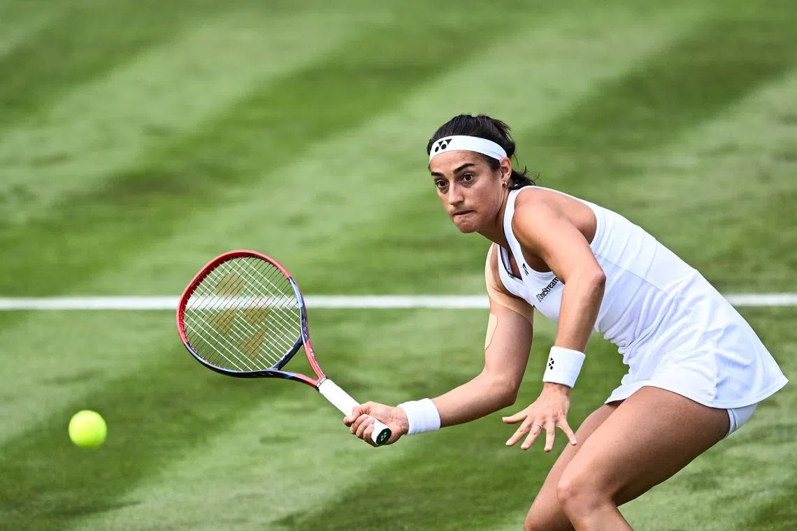 France's Caroline Garcia returns the ball to US player Katie Volynets during their women's singles tennis match.