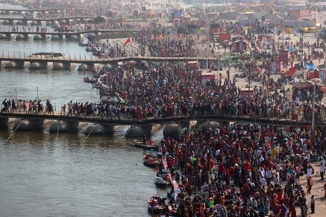 FILE PHOTO: Devotees gather to take a dip at Sangam, the confluence of the Ganges and Yamuna rivers with the mythical invisible Saraswati river, to mark Maghi Purnima, one of the auspicious days during the \"Maha Kumbh Mela\", or the Great Pitcher Festival, in Prayagraj, India, February 12, 2025. REUTERS/Ritesh Shukla/File Photo