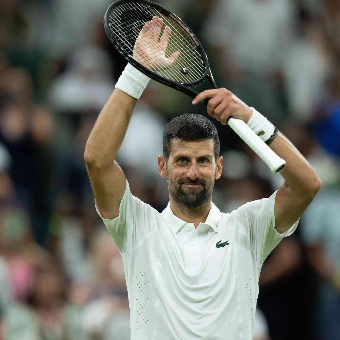 Jul 1, 2026; London, United Kingdom; Novak Djokovic of Serbia celebrates winning his match against Stefanos Tsitsipas of Greece on day three at All England Lawn Tennis and Croquet Club.  Mandatory Credit: Susan Mullane-Imagn Images