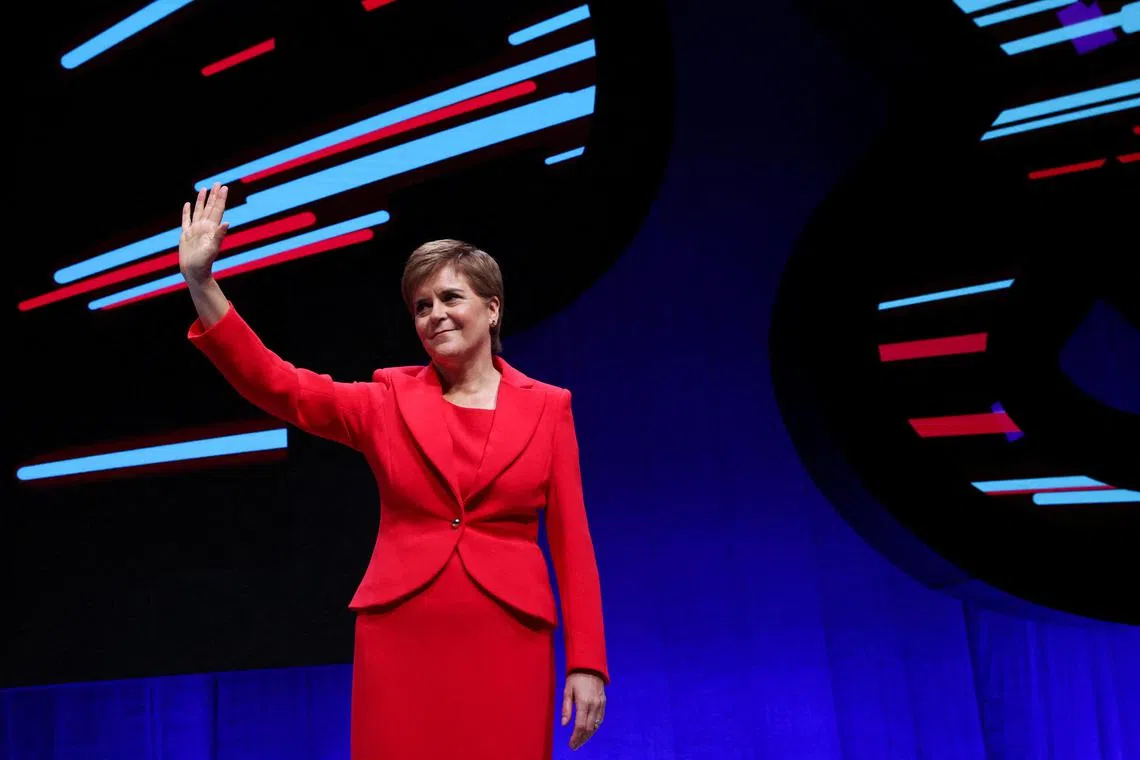 FILE PHOTO: Scotland's First Minister and Scottish National Party (SNP) Leader Nicola Sturgeon waves during the Scottish National Party (SNP) Annual National Conference in Aberdeen, Scotland, Britain October 10, 2022. REUTERS/Russell Cheyne/File Photo