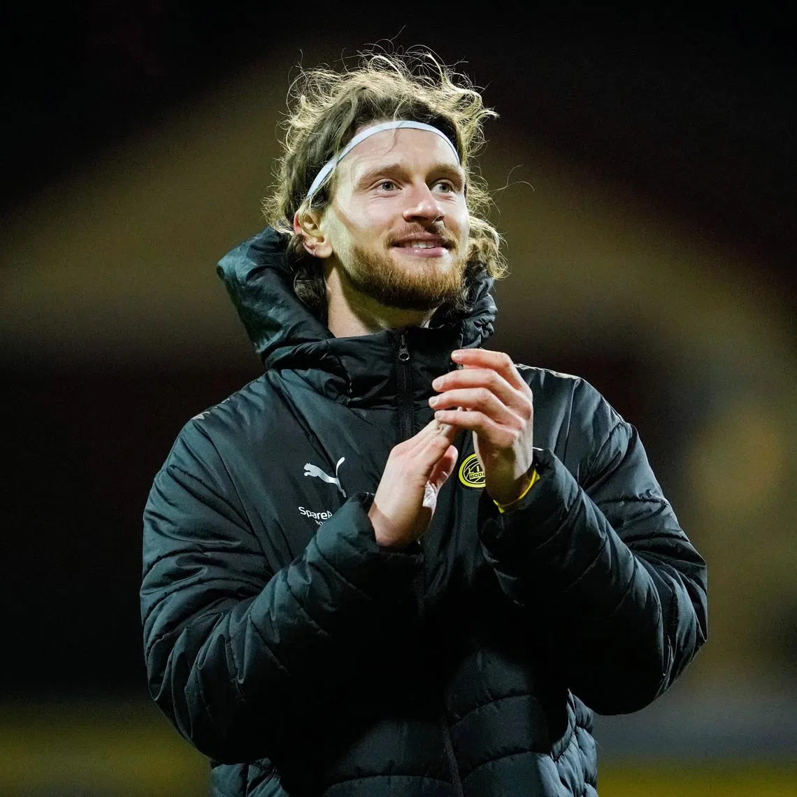 Soccer - UEFA Champions League - Round of 16 - First Leg - Bodo/Glimt v Sporting CP - Aspmyra Stadion, Bodo, Norway - March 11, 2026 Bodo/Glimt's Kasper Hogh applauds fans after the match Fredrik Varfjell/NTB via REUTERS