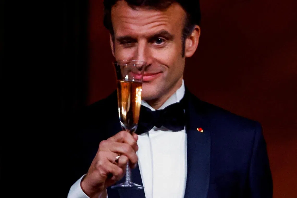 President Emmanuel Macron makes a toast, during a State Dinner at the White House, on Dec 1, 2022.