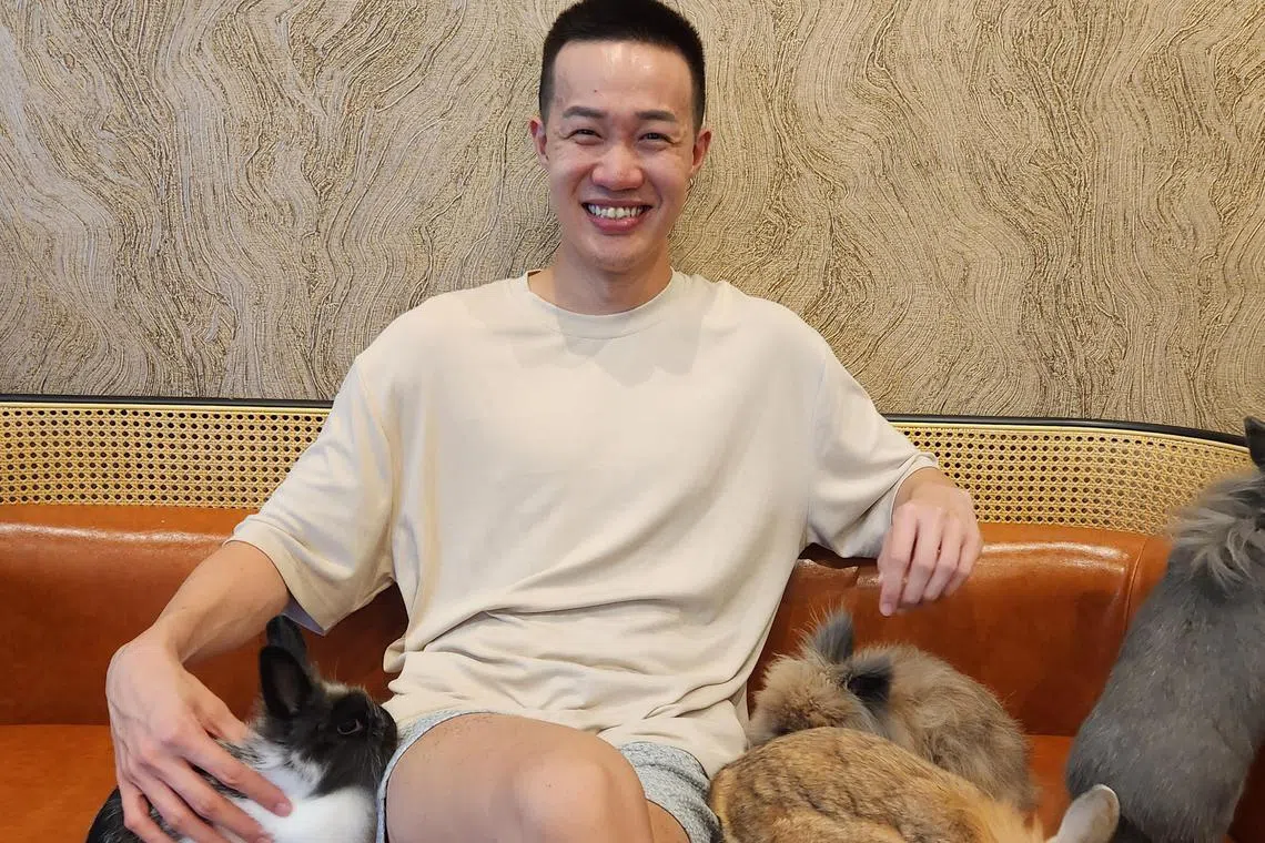 Brandon Chong and his four pet rabbits.