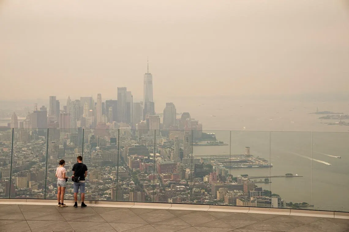 The sky in New York is tinged with an orange haze and the air smelled acrid on July 16.
