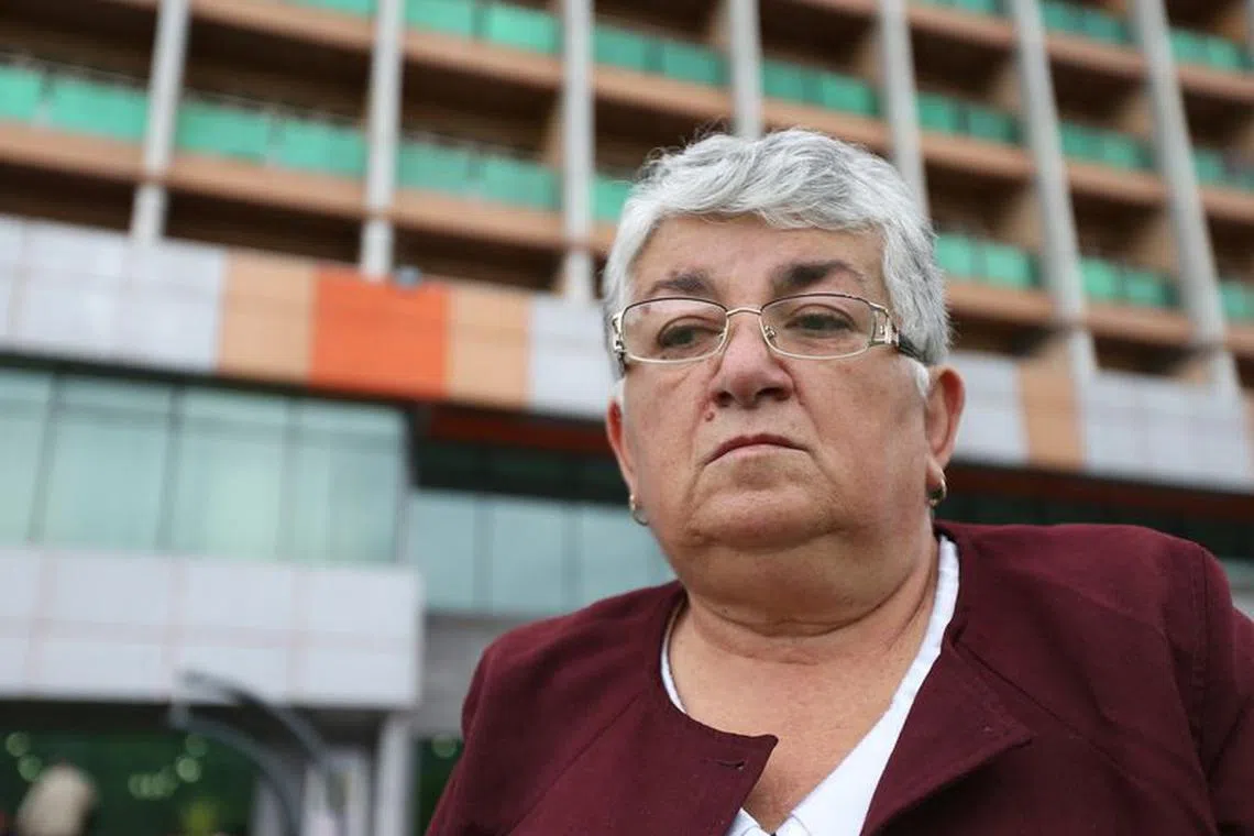 Refugee from the Nagorno-Karabakh region Vera Petrosyan, 70, a retired history teacher, speaks to a journalist outside a temporary accommodation centre in the town of Goris, Armenia, September 26, 2023. REUTERS/Irakli Gedenidze