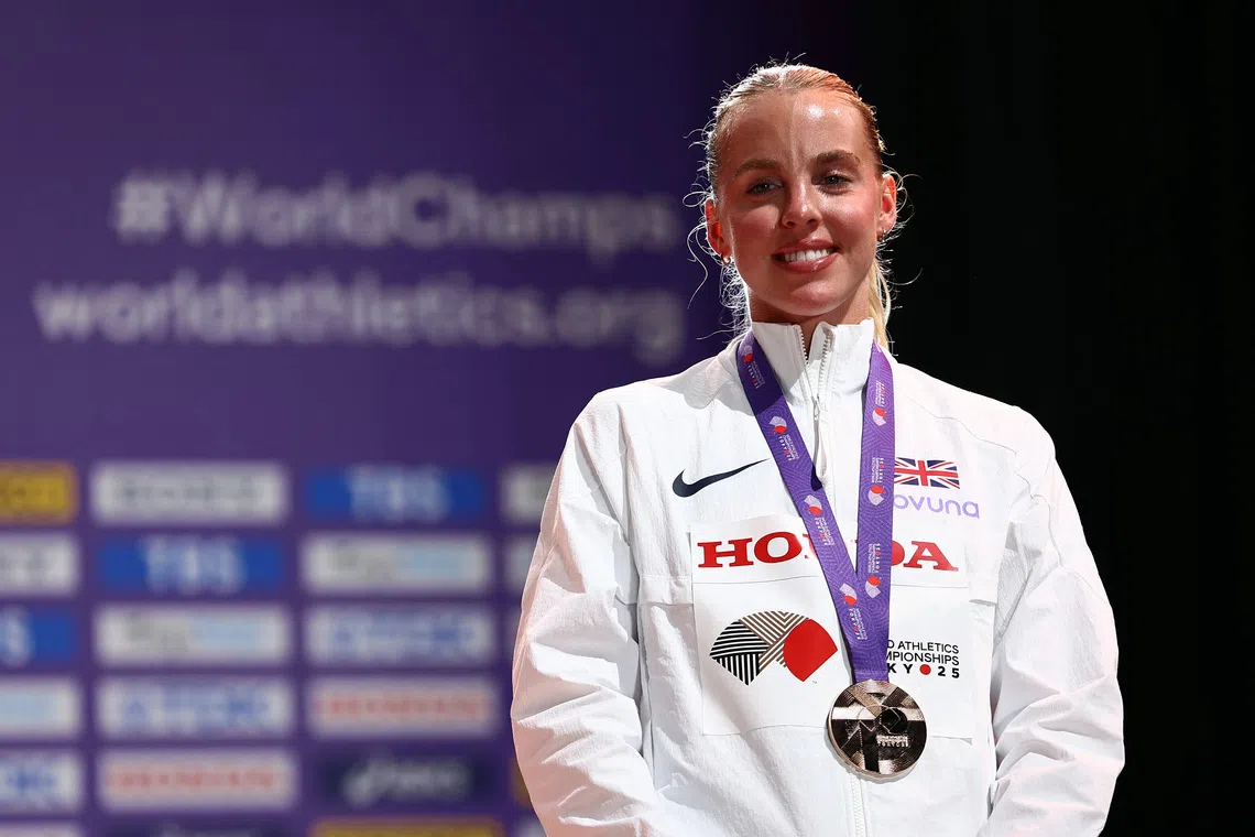 World Athletics Championships Tokyo 2025 - Women's 800m Medal Ceremony - Japan National Stadium, Tokyo, Japan - September 21, 2025 Bronze medallist, Britain's Keely Hodgkinson celebrates on the podium REUTERS/Eloisa Lopez