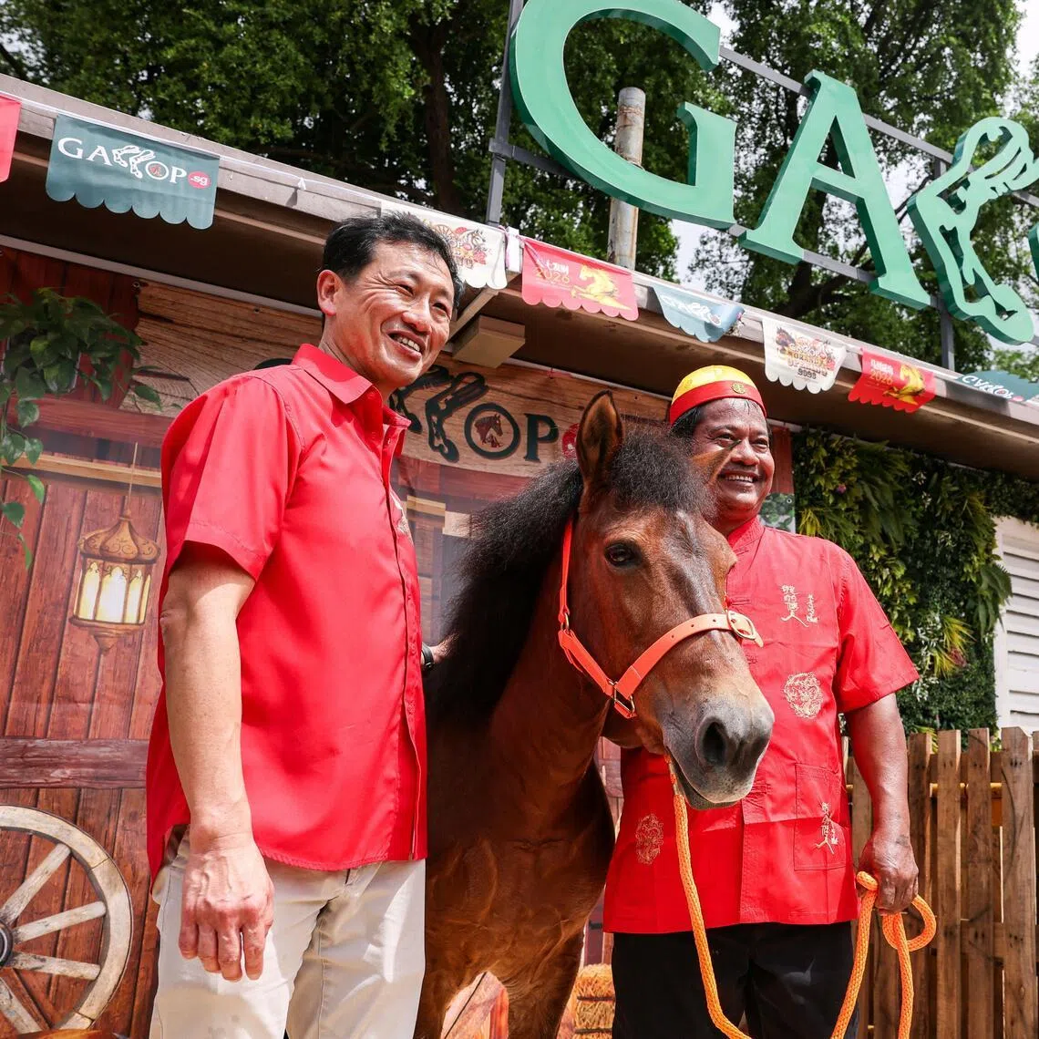 Minister for Health Ong Ye Kung (left) posing for a photo with a pony at the opening of the new Gallop.sg stables along Admiralty Road East on Feb 21, 2026. ST PHOTO: BRIAN TEO
