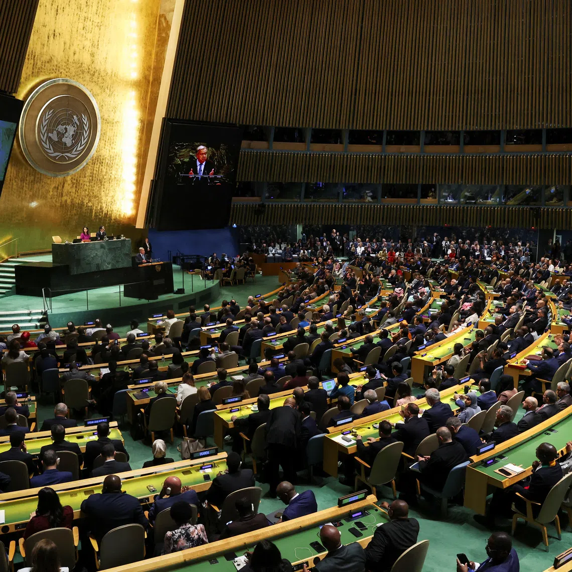 FILE PHOTO: United Nations delegates watch as UN Secretary-General Antonio Guterres addresses the 80th General Assembly at UN headquarters in New York City, U.S., September 23, 2025. REUTERS/Shannon Stapleton/File Photo