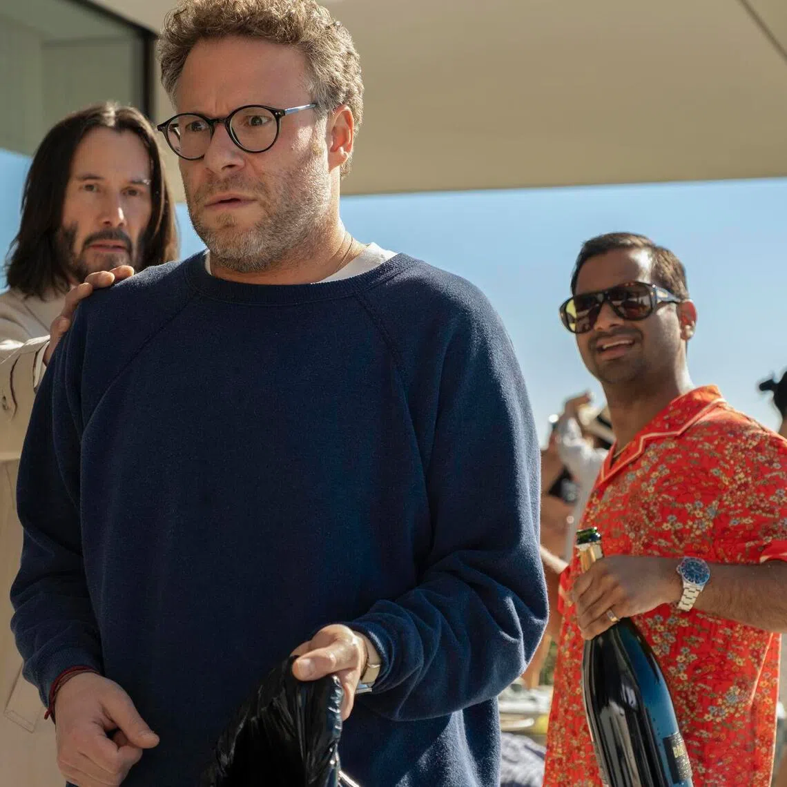 (From left) Keanu Reeves, Seth Rogen and Aziz Ansari in Good Fortune.