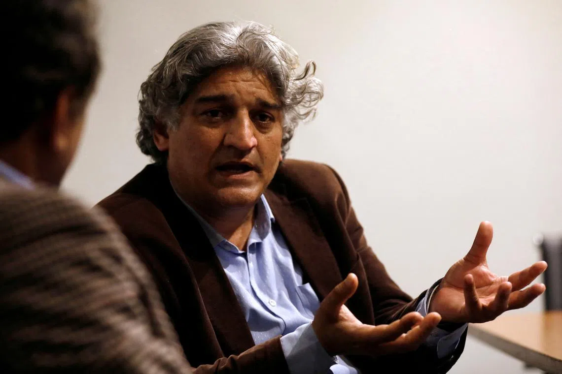 FILE PHOTO: Matiullah Jan, a journalist and columnist, gestures during an interview with Reuters at his office in Islamabad, Pakistan March 13, 2019. Picture taken March 13, 2019. REUTERS/Akhtar Soomro/File Photo