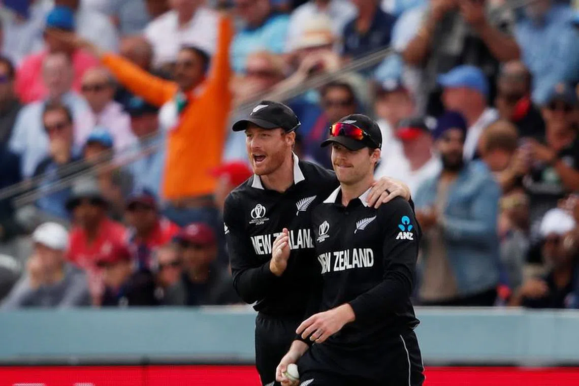 Cricket - ICC Cricket World Cup Final - New Zealand v England - Lord's, London, Britain - July 14, 2019   New Zealand's Lockie Ferguson celebrates taking a catch to dismiss England's Eoin Morgan with team mate    Action Images via Reuters/Andrew Boyers/file photo