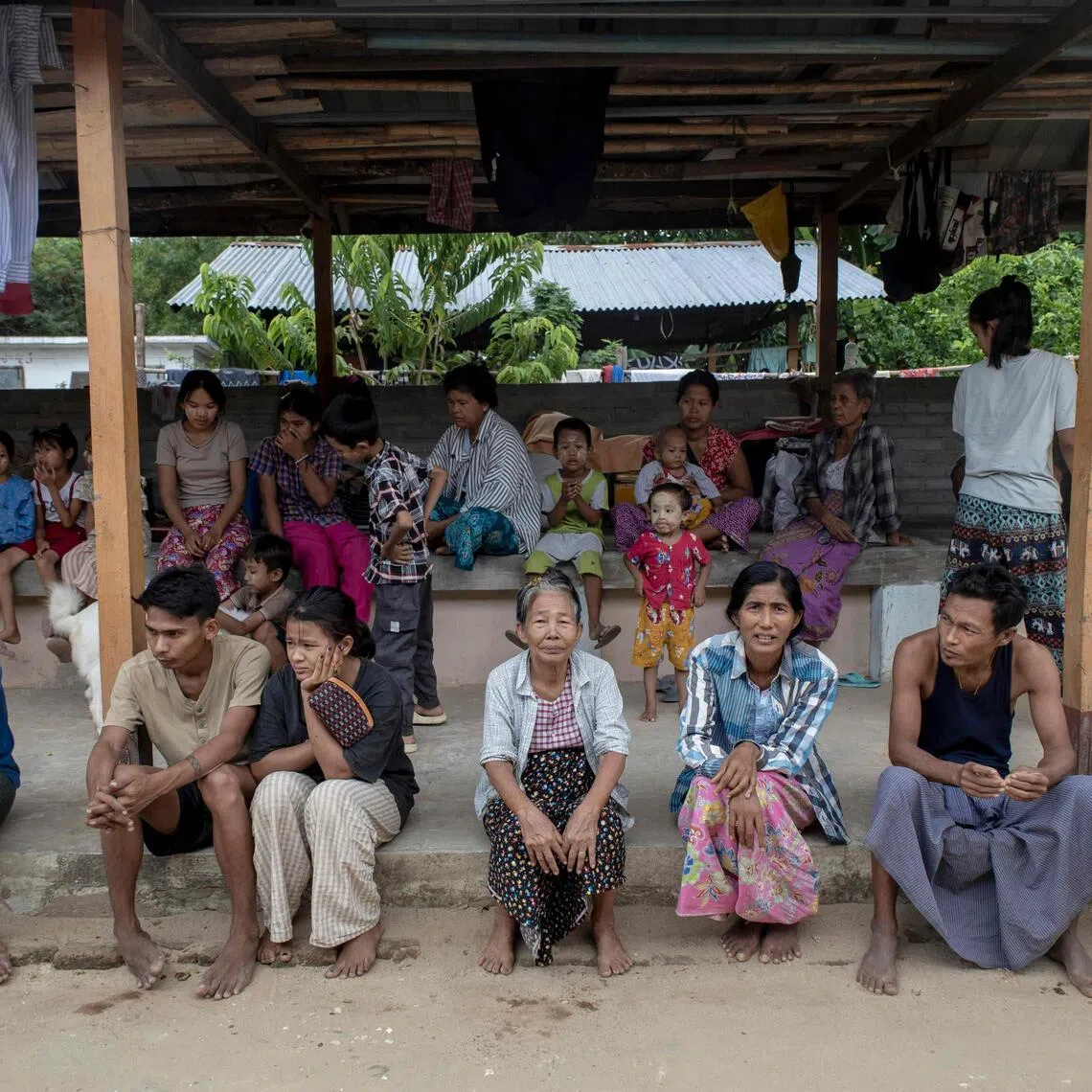 People displaced by fighting between Myanmar’s military and the People’s Defence Forces in Myit Chay sitting in a shelter on the grounds of a monastery near Pakokku in Myanmar’s Magway region.