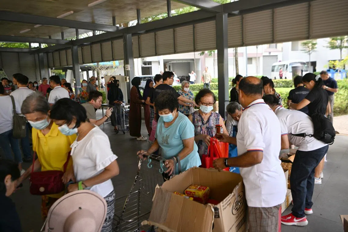 Grassroots volunteers teamed up with community organisations to give out free food and sundries to residents.