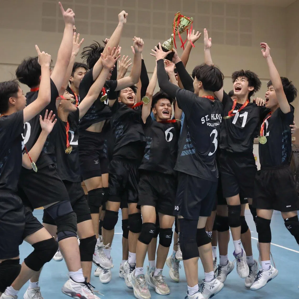 St. Hilda's Secondary School celebrating after winning the B Division Boys Volleyball final ST PHOTO: TARYN NG