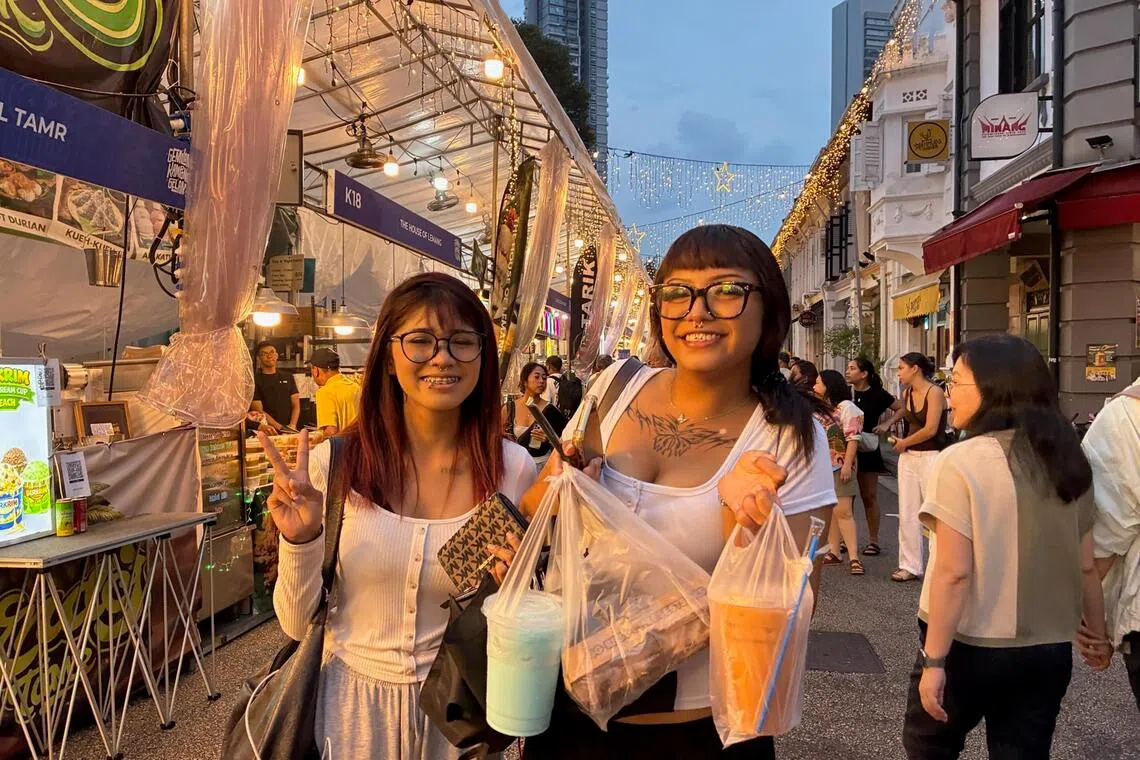 Ms Nurul Nabilah Qushaira and Ms Felisya Qasheera at the Gemilang Kampong Gelam Ramadan Bazaar.