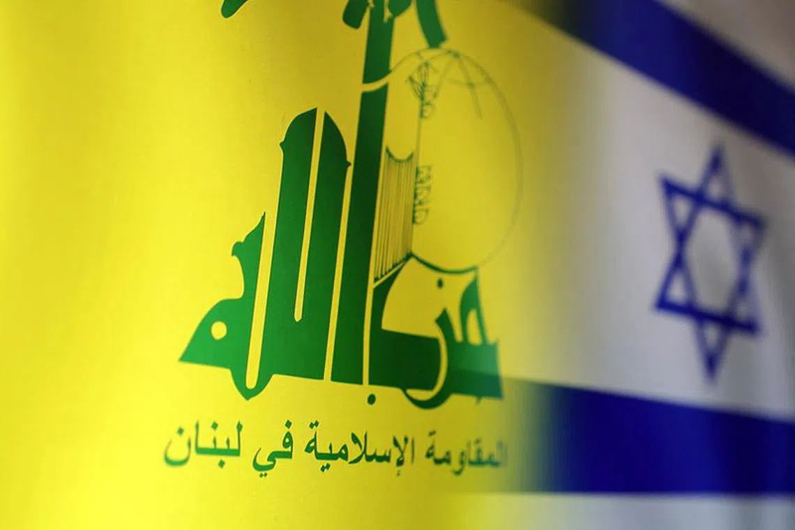 FILE PHOTO: Hezbollah and Israel flags are seen in this illustration taken, October 15, 2023. REUTERS/Dado Ruvic/Illustration/File Photo