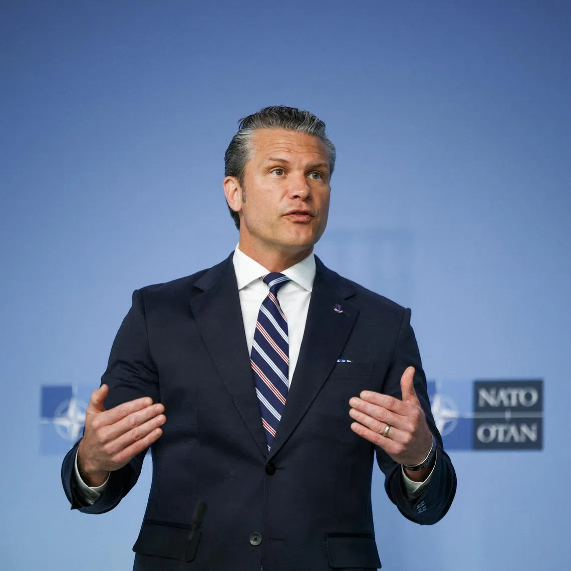U.S. Defense Secretary Pete Hegseth talks to the media on the day of a meeting of NATO defence ministers at the alliance's headquarters in Brussels, Belgium, June 18, 2026. REUTERS/Stoyan Nenov