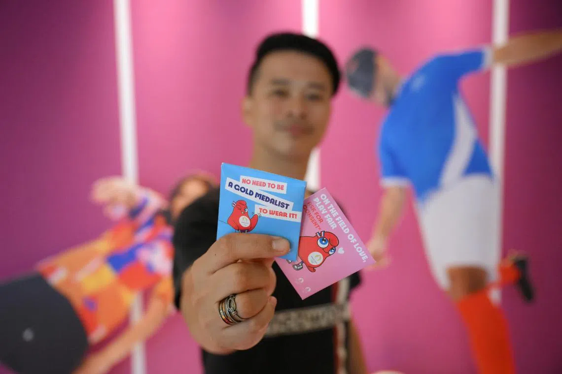 The Straits Times sports correspondent David Lee with Athlete issued condom from the Olympic Village during the Paris 2024.