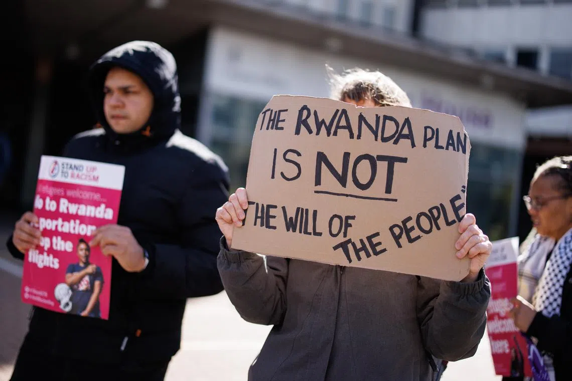 People protest against the British government's Rwanda deportation scheme outside a Home Office immigration reporting centre in Croydon, south London, on April 29.