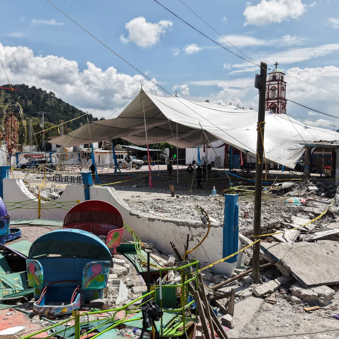 A drone view showing the damage after a fireworks explosion that left at least 10 people dead at a village festival in central Mexico.