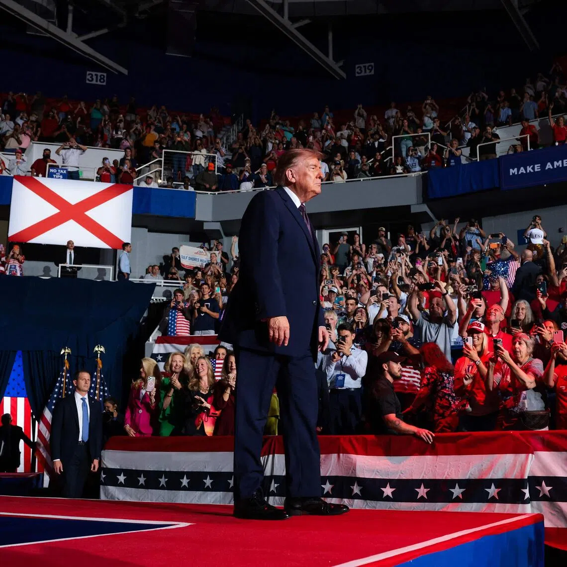 US President Donald Trump arrives onstage for a campaign rally in Mobile, Alabama, on Oct 2.