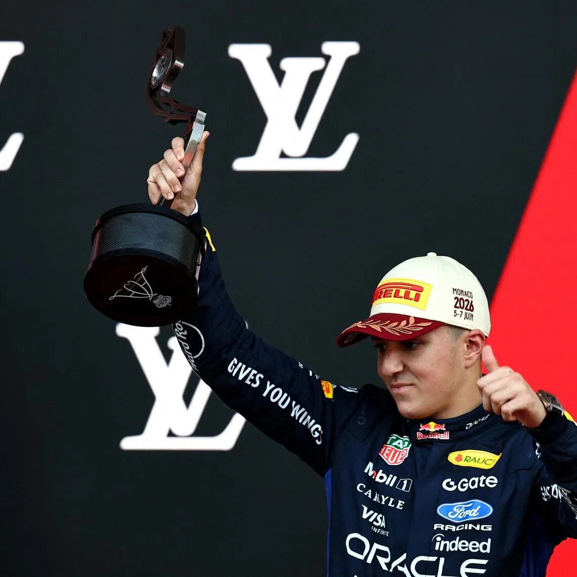 Red Bull’s Isack Hadjar celebrating with the trophy on the podium after finishing third in the Monaco Grand Prix at the Circuit de Monaco on June 7.