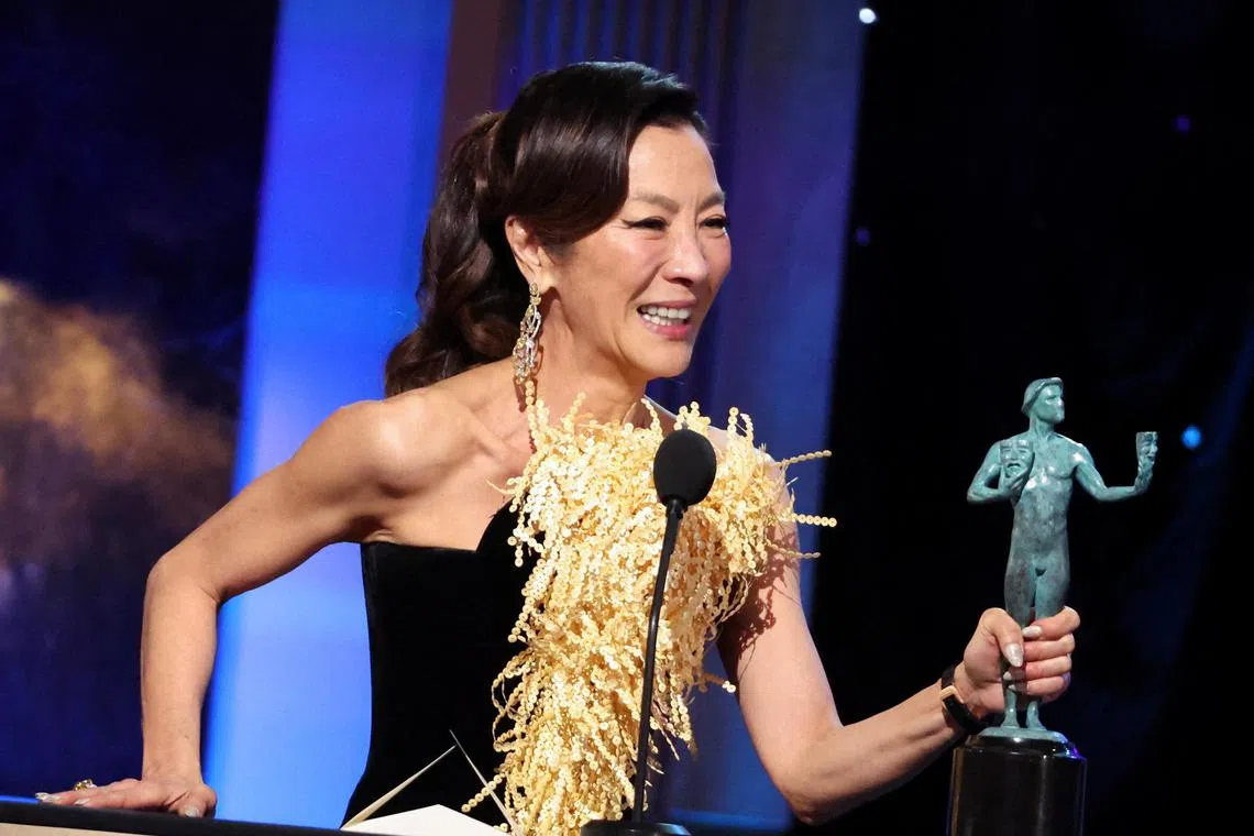 Michelle Yeoh accepts the Outstanding Performance by a Female Actor in a Leading Role for "Everything Everywhere All at Once" during the 29th Screen Actors Guild Awards.