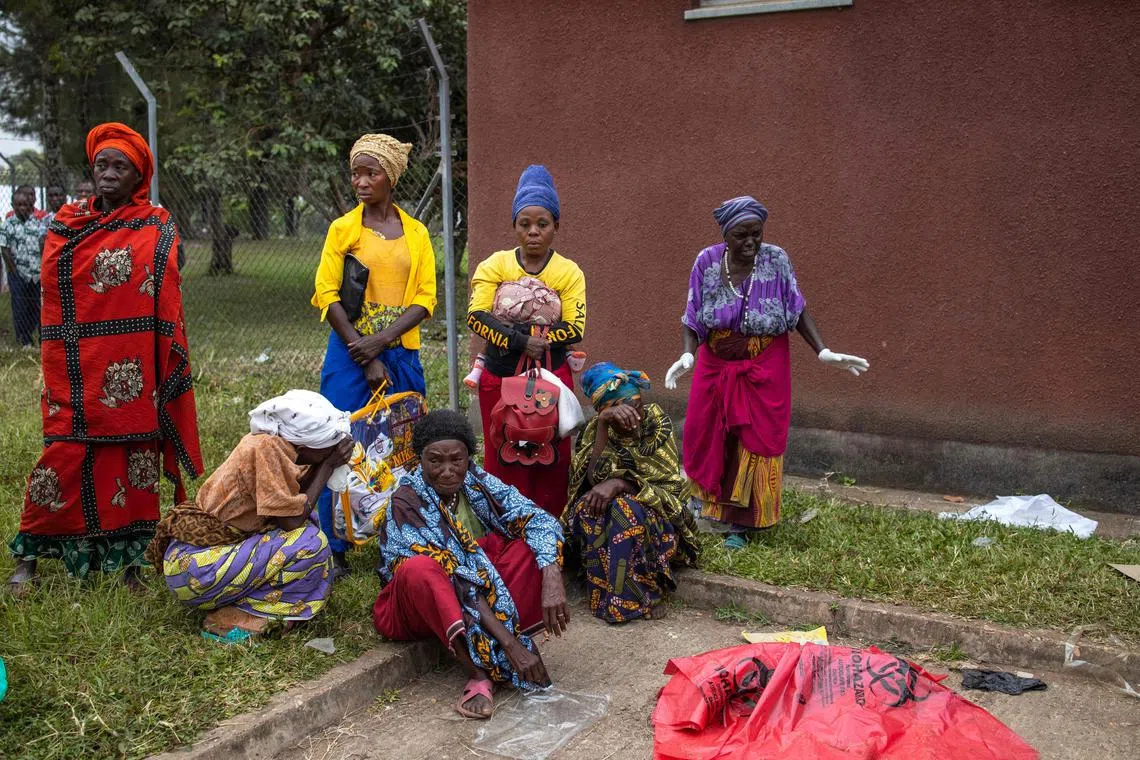 Relatives of the Mpondwe Lhubiriha Secondary School victims attack gather at the Bwera General Hospital Mortuary on June 18.