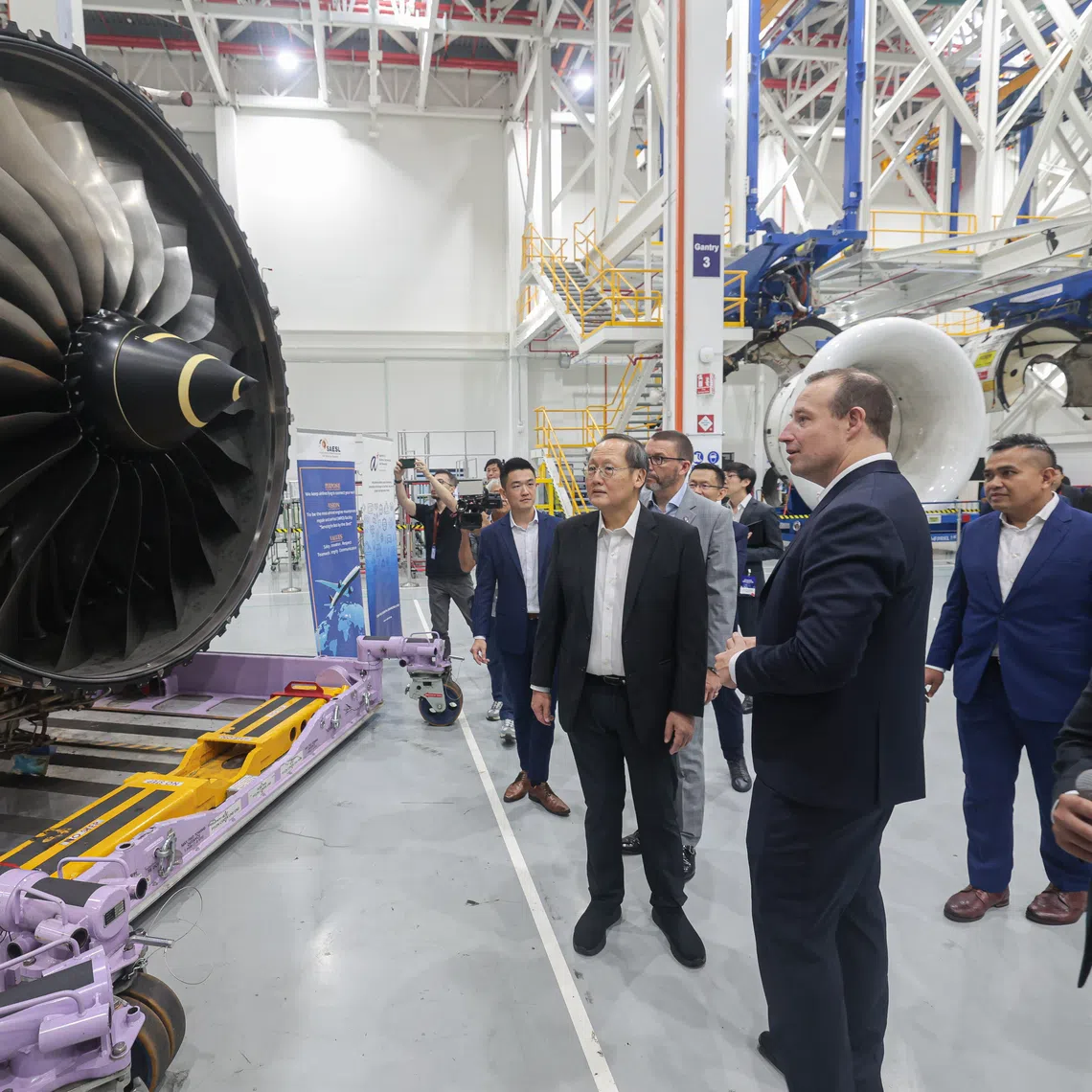 Minister-in-charge of Energy and Science and Technology Tan See Leng (centre) touring the Rolls-Royce factory on Oct 3.