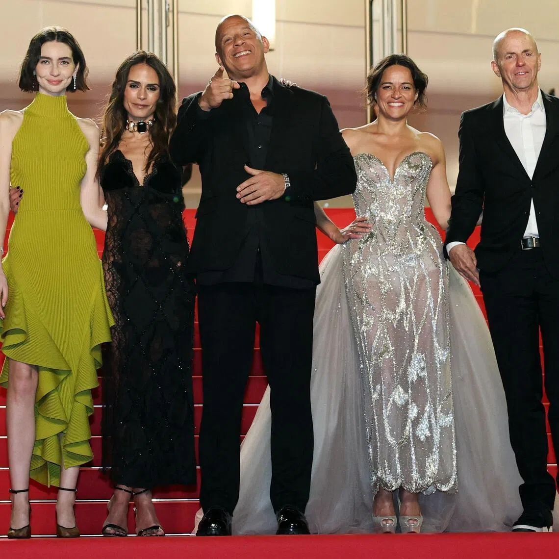 (From left) US model and actress Meadow Walker, US actress Jordana Brewster, US actor Vin Diesel, US actress Michelle Rodriguez and US producer Neal Moritz arrive for the screening of the film The Fast And The Furious at the 79th edition of the Cannes Film Festival on May 13. 