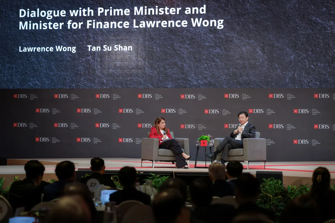 Prime Minister Lawrence Wong participates in a dialogue moderated by DBS Bank CEO Tan Su Shan during the DBS Asia Future Forward Conference at Suntec Convention and Exhibition Centre on Oct 12.