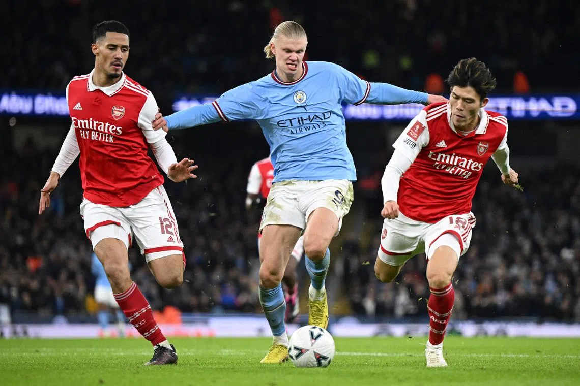 Manchester City striker Erling Haaland (centre) can now be found challenging Arsenal players in the crypto world, after the English Premier League gave French fantasy sports platform Sorare a four-year licence to sell digital sports cards of players from all 20 Premier League clubs.