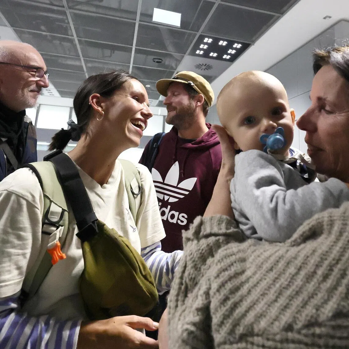 Members of a German family arriving in Frankfurt, Germany, on March 3, after fleeing Dubai.