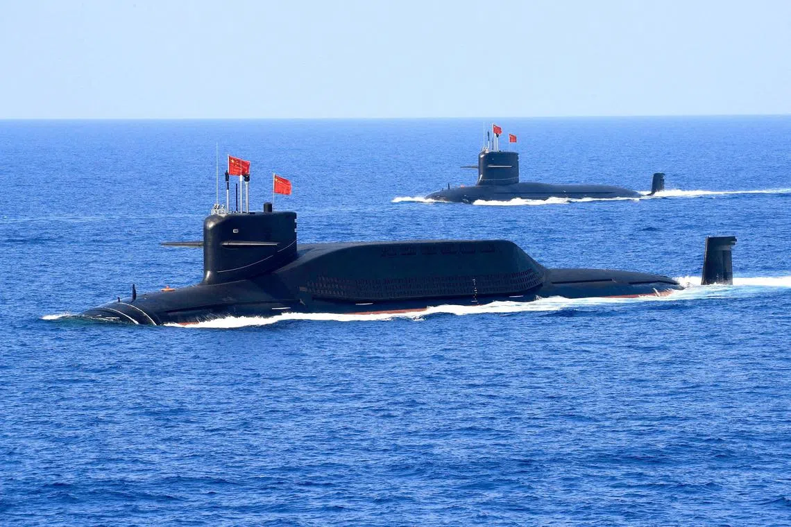 FILE PHOTO: A nuclear-powered Type 094A Jin-class ballistic missile submarine of the Chinese People's Liberation Army (PLA) Navy navigates during a military display in the South China Sea, April 12, 2018. REUTERS/Stringer/File Photo