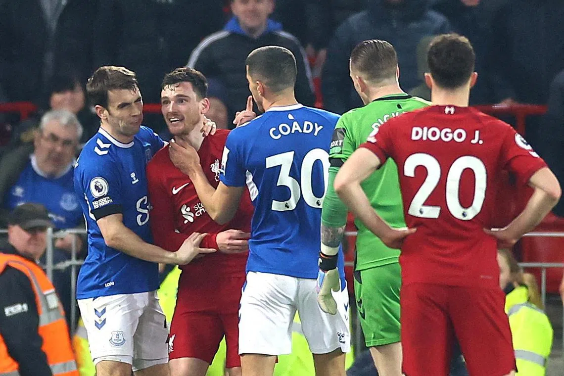 Liverpool's Andrew Robertson clashes with Everton's Jordan Pickford, Seamus Coleman and Conor Coady.