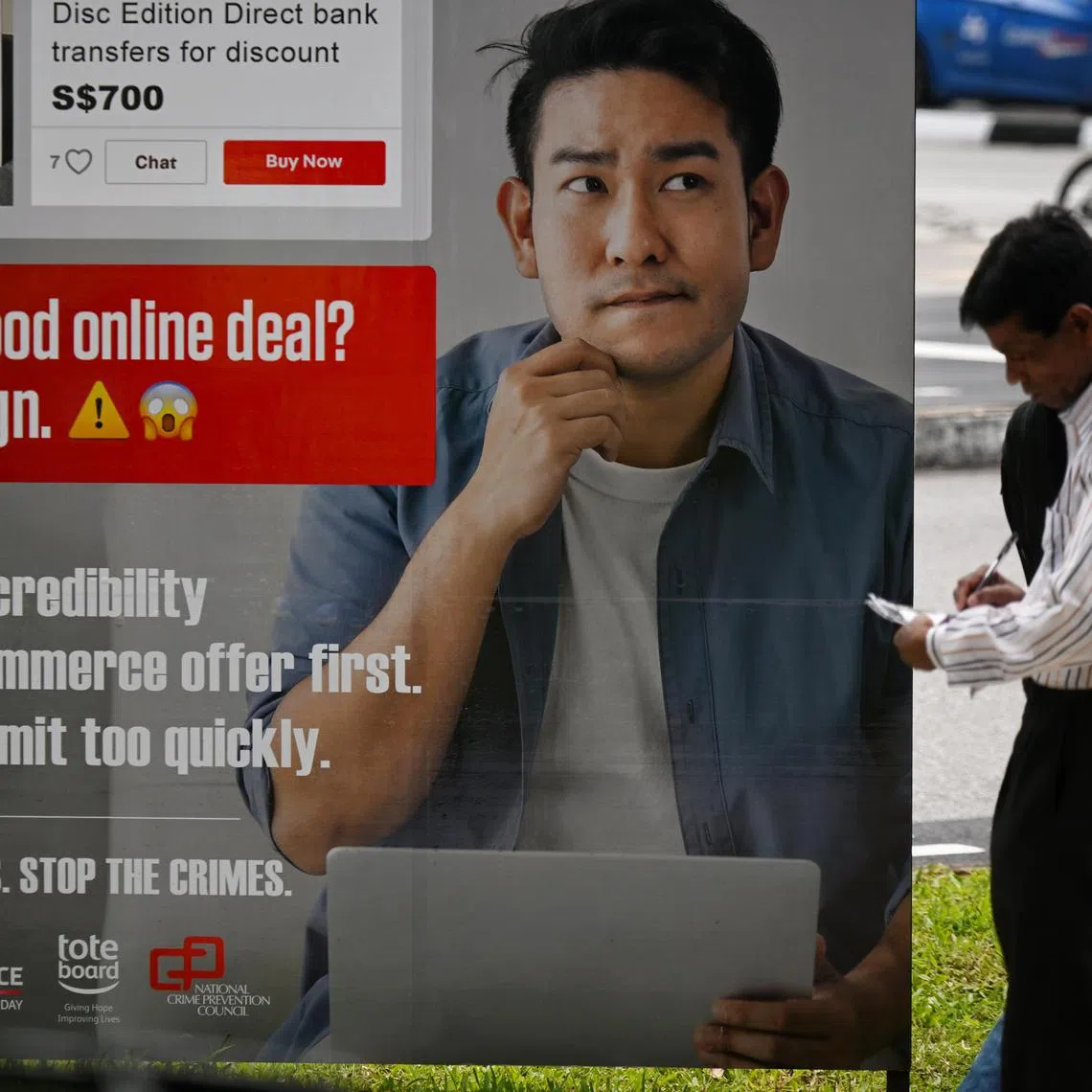 ST20230216_202336166650 Kua Chee Siong/ pixgeneric/ Generic pix of an anti-scam poster seen along Yishun Ring Road on Feb 16, 2023.