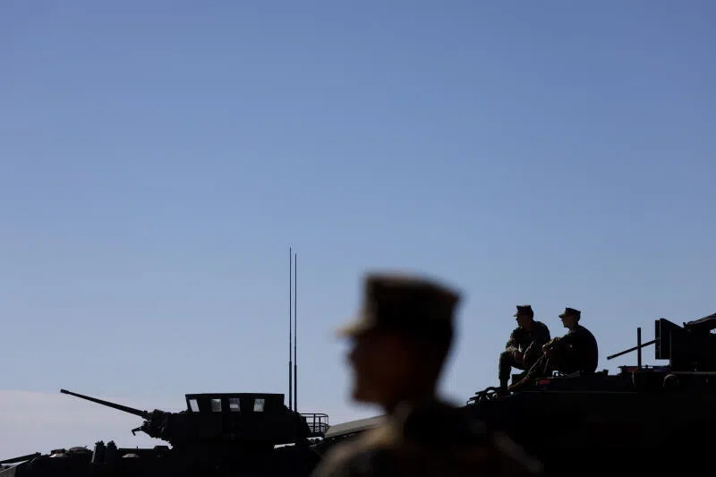 US Marines sit on a tank ahead of an event marking the US Marine Corps 250th anniversary at Camp Pendleton in Oceanside, California, USA, on Oct 18.