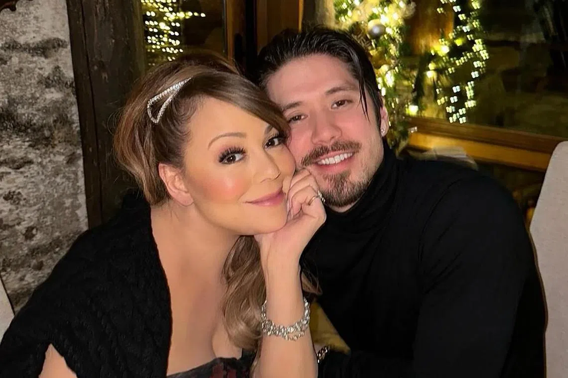 Singer Mariah Carey (left), pictured here in an Instagram post dated Dec 27, 2022, has broken up with Bryan Tanaka (right), her dancer boyfriend of seven years.