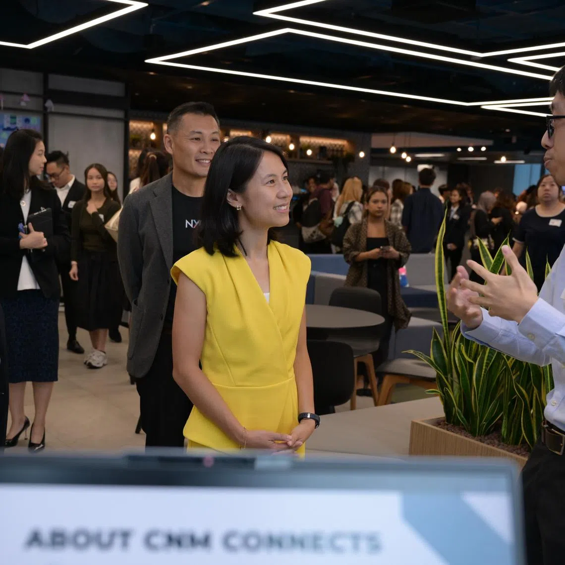 Josiah Cheng (left) from NUS, presenting the university?s initiative to bring digital access and digital literacy to disadvantaged groups to senior parliamentary secretary Goh Hanyan at Gen2025 on June 5, 2025.