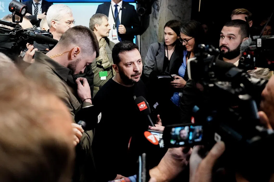 Ukrainian President Volodymyr Zelensky speaks to journalists after a joint press conference for the Nordic Summit, in Oslo, Norway.