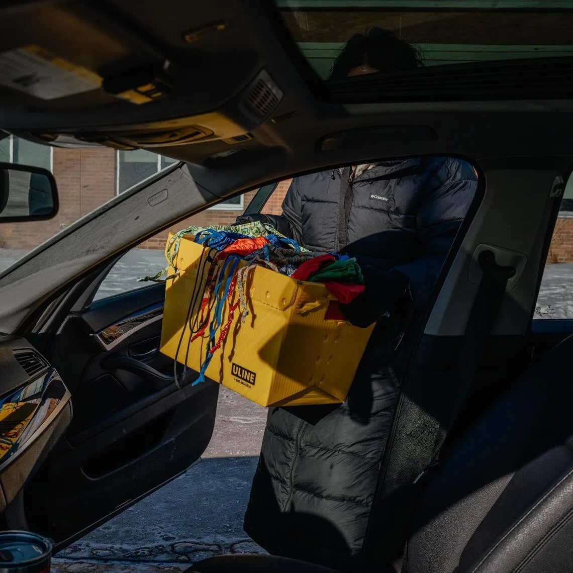 A team of social workers and staff members at Fridley Middle School in suburban Minneapolis deliver school supplies and groceries to families who are afraid to send their children to school, on Jan 28, 2026.