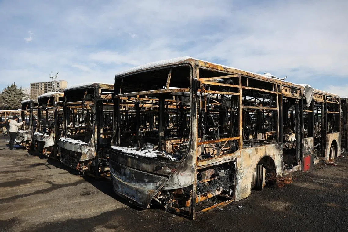 Buses that were burned during recent protests in Tehran.