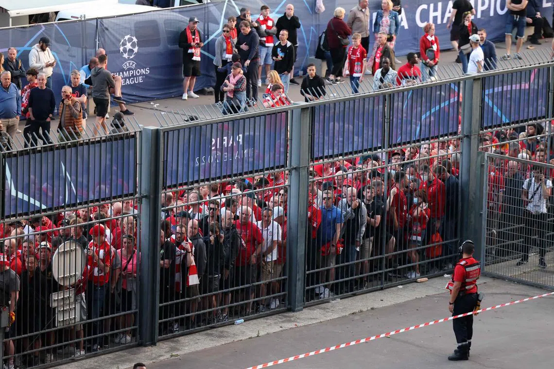 Liverpool fans standing outside the Stade de France on May 28, 2022, unable to get into the stadium in time for the Champions League final against Real Madrid.