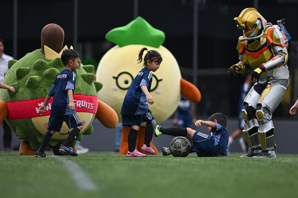 Singaporean social enterprise Wow Movement organises a football match between mascots and six-year-olds from Lion City Sailors Academy on March 25, 2026, ahead of the 2026 FIFA World Cup.