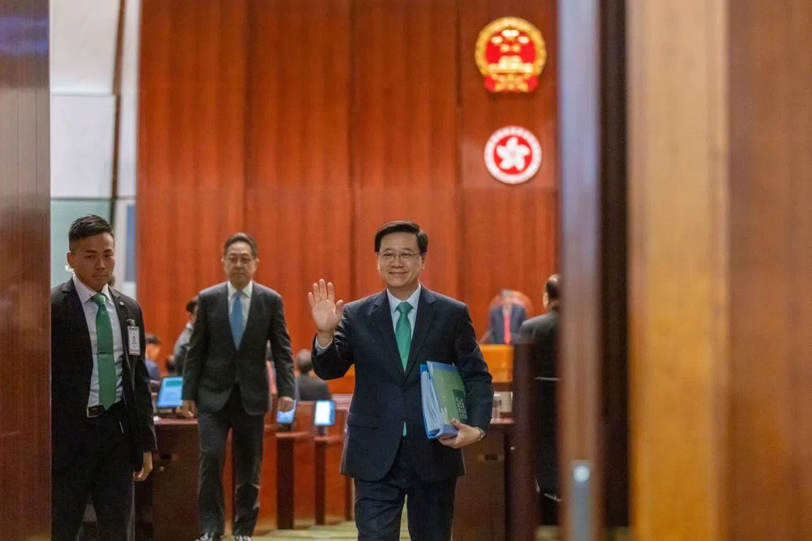 Hong Kong's chief executive John Lee leaves following his policy address at the Legislative Council in Hong Kong, on Oct 25.